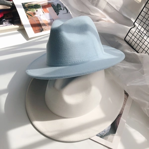 Close-up of the smooth wool felt texture and wide brim stitching on the fedora hats