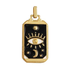 Macro detail of tarot card pendant with gold finish, mystic eye and celestial patterns