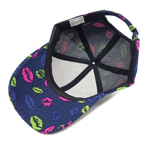 Detail view of the baseball cap's inner black mesh lining and polyester wash label