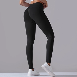 Detail view of black high-waisted seamless leggings with peach butt lifting design