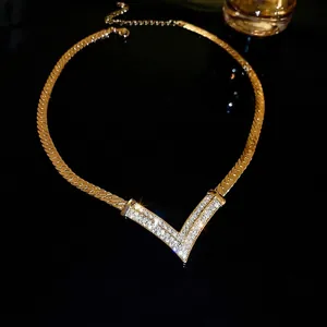 Gold plated V-shaped necklace with micro-paved rhinestones on a snake chain