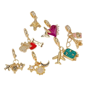 Travel Diary charms in gold finish featuring Eiffel Tower and Enamel heart pendants