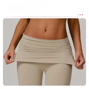 Close-up of gathered high waistband design on beige flare yoga pants for tummy control