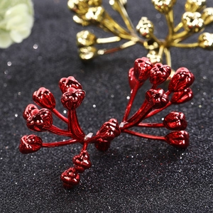 Festive red and gold artificial berry cluster ornaments with a shiny metallic finish