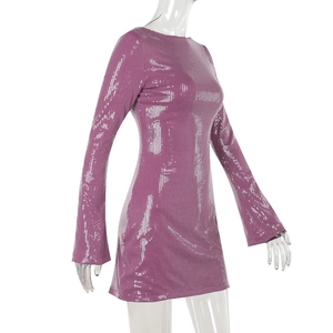 Detail of burgundy sequin mini dress featuring long flared sleeves and round neckline