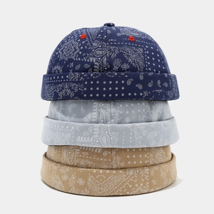 Vintage paisley pattern brimless docker caps in blue, grey, and khaki colors