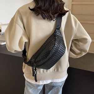 Sleek black woven leather sling bag for men and women featuring adjustable crossbody strap