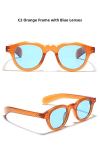Detail of vintage round sunglasses with translucent orange frames and blue tinted lenses
