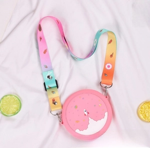 Pink silicone donut bag for kids with space patterns and colorful rainbow strap