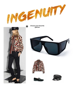 Macro view of black oversized square sunglasses with wide temples and retro modern design