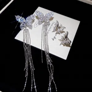 Elegant silver butterfly tassel earrings set with cubic zirconia and long chain details