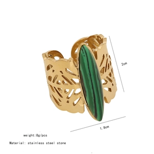 Detail view of vintage gold hollow ring with green malachite stone and size dimensions