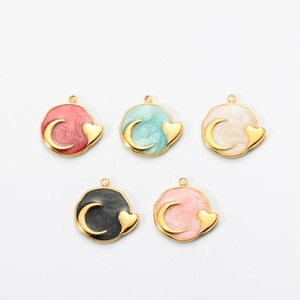 Detailed macro view of colorful celestial moon heart charms in stainless steel