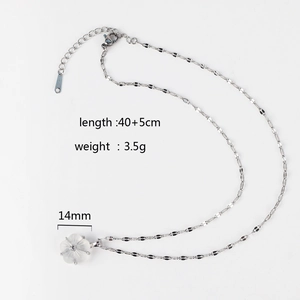 Detail of silver stainless steel necklace with 14mm white shell flower pendant