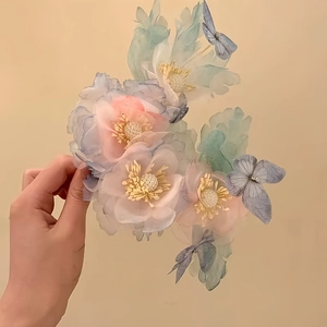Handmade floral hair clip with mesh flowers, butterflies and pearls for elegant styling