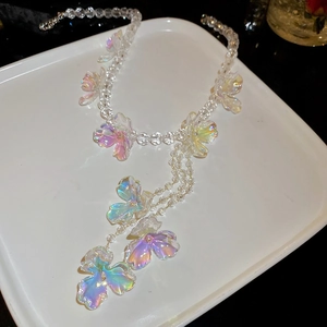 Detailed close-up of French style floral tassel necklace with colorful gradient beads