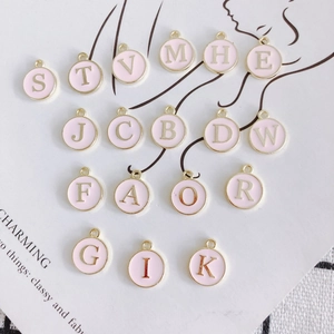 Pink enamel round alphabet charms with gold letters for DIY jewelry making