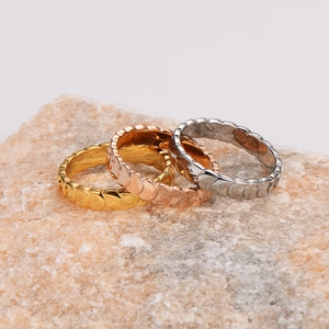 Three-piece stainless steel woven rings in gold rose gold and silver finishes