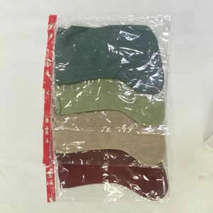Set of four plaid burlap Christmas stockings in diverse colors packed in a clear polybag