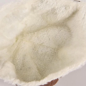 Winter bomber hat with thick white fleece lining and warm ear flaps for cold weather protection