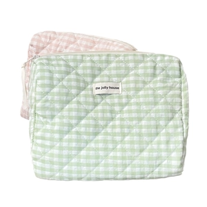 Pink and green plaid quilted cotton makeup bags with a minimalist woven label