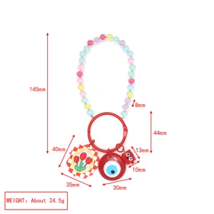Detailed size and weight specs for the blue eye and flower bead keychain accessory