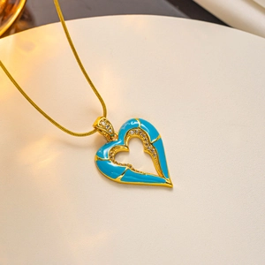 18K gold plated snake chain necklace with a blue enamel heart pendant and crystals