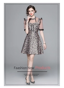 Close-up of floral embroidery dress with beaded buttons and black lace collar details