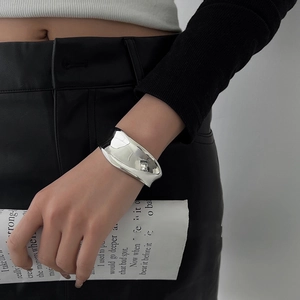 Minimalist silver irregular wide open bangle with polished liquid metal geometric design