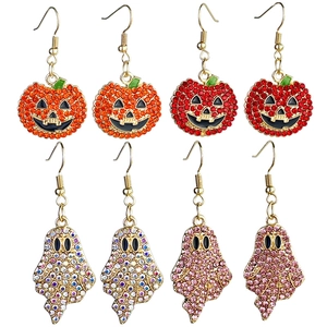 Detailed view of Halloween pumpkin and ghost drop earrings with sparkling rhinestones