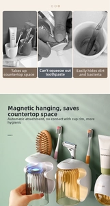 Dettaglio dell'organizer da bagno con tazze magnetiche e distributore di dentifricio