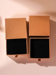 Brown kraft jewelry gift box featuring black flocking lining and drawer-style pull-out design