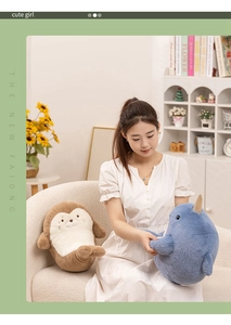 Detail of plush narwhal and seal toys held by a girl in a cozy living room setting