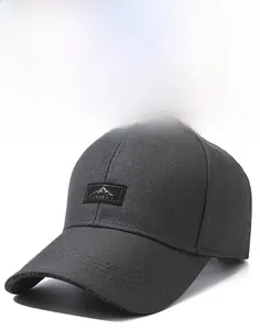 Close-up of dark grey twill fabric baseball cap featuring a mountain patch and China text