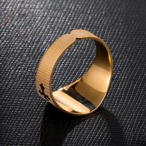 Detailed close-up of vintage 18K gold stainless steel ring with textured frosted surface