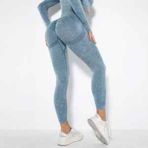 Back view of seamless scrunch butt yoga pants with light blue acid wash texture