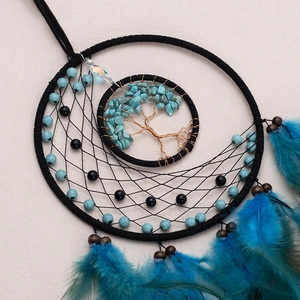 Handmade Tree of Life dream catcher with blue feathers and turquoise stones for wall decor