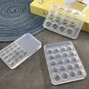 Detailed view of clear silicone palette molds in round and square shapes for DIY resin art