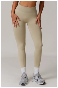 Detail view of khaki seamless high waisted leggings featuring ribbed tummy control waistband