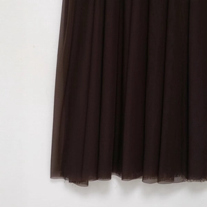 Deep brown fashion dress featuring layered mesh fabric details and elegant pleats