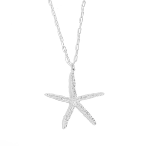 Minimalist silver starfish necklace with hammered texture on a paperclip chain link