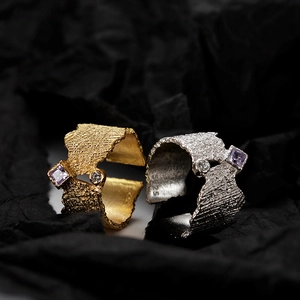 Artistic S925 silver irregular lava texture rings with purple gems on dark background