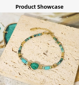 Detail of bohemian turquoise beaded bracelet with gold accents on stone background