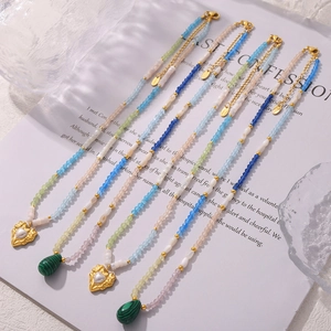 Multi-colored beaded necklace with 18k gold-plated heart pendant and malachite stone