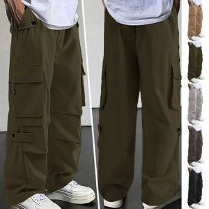 Army green functional parachute cargo pants with wide leg and loose fit design