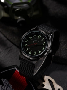 Macro shot of SHIHE tactical watch dial with luminous numerals and black nylon strap