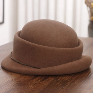 Detail of wool cloche hat with rolled brim and delicate black rhinestone chain detail