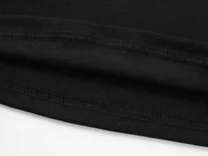 Detail of double-needle stitching and texture on black slim fit T-shirt hemline