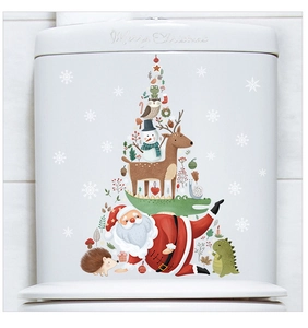 Detail of Christmas Santa and reindeer stickers applied to a white toilet tank