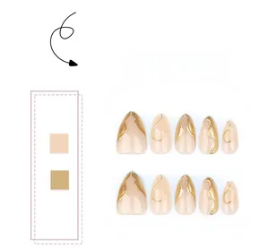 Macro detail of almond press-on nails with 3D golden textured relief on nude base
